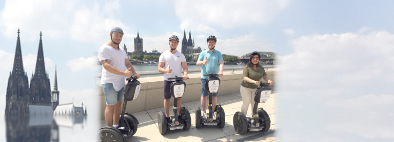 Mitarbeiter der Agentur Thorsten Müller auf einem Segway, im hintergrund ist der Kölner Dom zu sehen