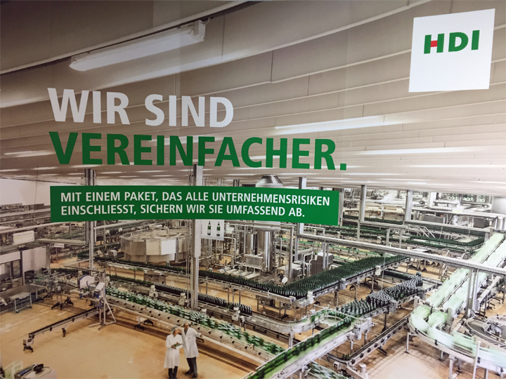 Werbeplakat von HDI für umfassende Firmenversicherungen.